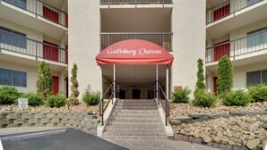 A building with a red awning labeled "Gatlinburg Chateau" and a staircase leading to the entrance. - 10 Minutes Walk To Anakeesta, 2BR/2BA, Sleeps 6, Elevator on Premises (Gatlinburg)