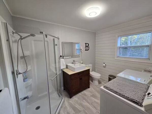 Shower, hair dryer, towels, soap