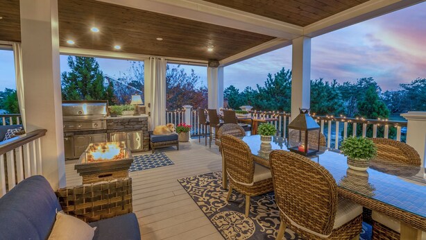 A covered patio with a grill, seating area, and a view of trees. - Luxury Meets the Beach! Private Pool/Hot Tub/Linens/11BR/Parking Steps to Beach! (Dewey Beach)