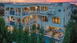 A multi-level modern house with a pool, balconies, and outdoor seating areas. - Luxury Meets the Beach! Private Pool/Hot Tub/Linens/11BR/Parking Steps to Beach! (Dewey Beach)