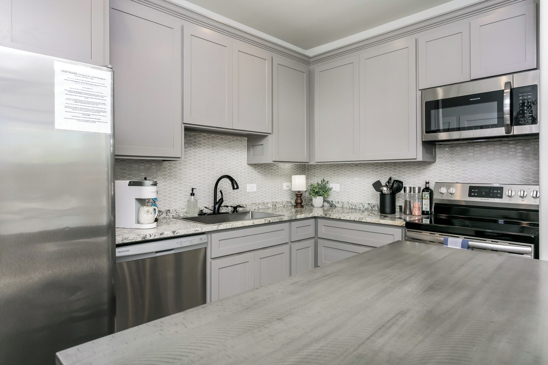 Fridge, microwave, coffee/tea maker, cookware/dishes/utensils