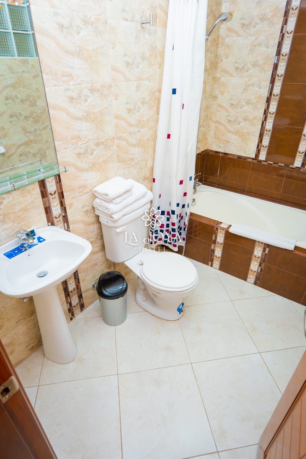A bathroom with a sink, toilet, and bathtub.