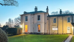 A large, two-story house with a well-maintained lawn and a stone pathway leading to the entrance. - 6 bedroom accommodation in Market Rasen (Market Rasen)