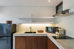 Superior Double Room | Private kitchen | Fridge, microwave, stovetop, electric kettle - Sunset Loft Seminyak, Bali (Seminyak)