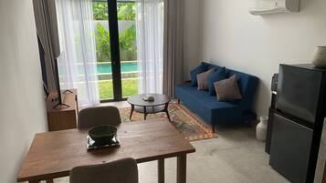 Suíte estúdio conforto | Área de estar