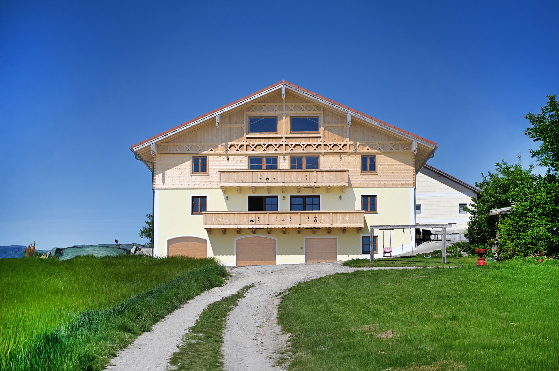 A two-story building with a symmetrical facade, multiple windows, and a central entrance.