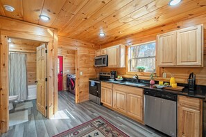 Fridge, microwave, oven, stovetop - Whisper Cabin: Hot Tub, Game Loft, Open Living, Minutes to Downtown Gatlinburg (Gatlinburg)