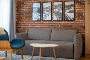 Apartamento luxo, sacada, vista para a cidade | Área de estar