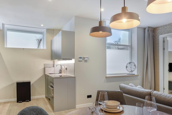 Dine in comfort under warm pendant lights, perfect for both meals and special moments.