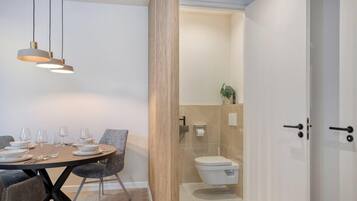 Shower, hair dryer, towels, shampoo