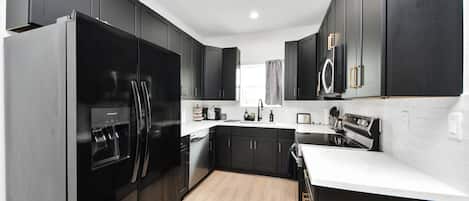 Coffee/tea maker, fridge, microwave, oven