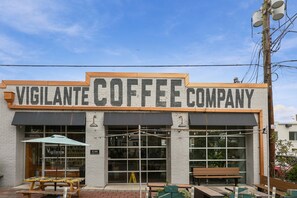A coffee shop with a sign that reads 'Vigilante Coffee Company.' - Near DC Group Getaway Free Parking + WiFi + Yard (Hyattsville)