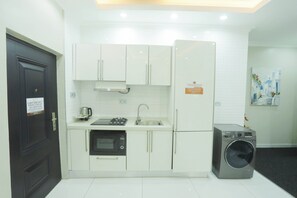 Fridge, microwave, oven, stovetop - Premium One Bedroom Apartment at Silicon Square (Accra)