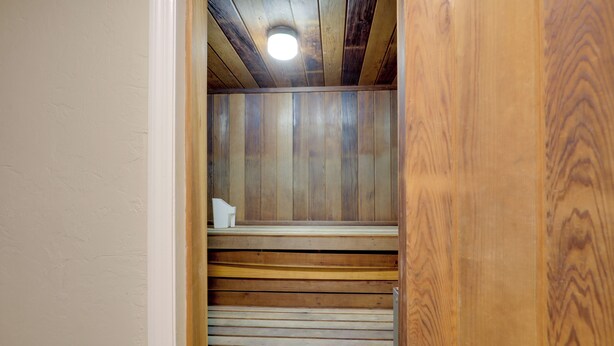 A wooden interior with a slatted ceiling and a white wall. - Steps to Shore: Ormond Beach Condo w/ Pool Access! (Ormond Beach)