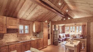 A rustic cabin interior with wooden walls and ceilings, a kitchen area with granite countertops, and a cozy living space with a sofa and fireplace. - 4-room chalet for 6 people in the heart of the old village of Grimentz: 1 bedroom with double bed an (Grimentz)