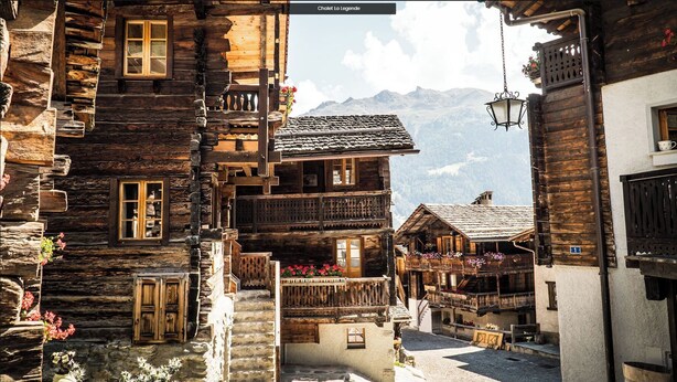 A traditional wooden building with balconies, a stone staircase, and a mountain backdrop. - 4-room chalet for 6 people in the heart of the old village of Grimentz: 1 bedroom with double bed an (Grimentz)