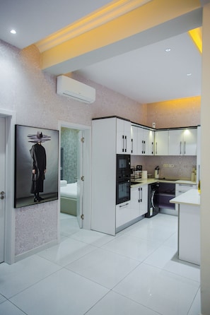 Fridge, microwave, oven, stovetop - Elegant Two Bedroom Apartment at Silicon Square (Accra)