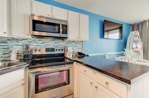 Condo, 1 Bedroom | Private kitchen | Fridge, oven, coffee/tea maker, toaster - 0310 Seaside Serenity 1 Bedroom Condo (Carolina Beach)