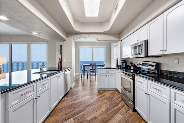 Fridge, microwave, oven, stovetop - 7th floor Beach Views! Sunset Views! Listen to the waves from every room! (Daytona Beach)