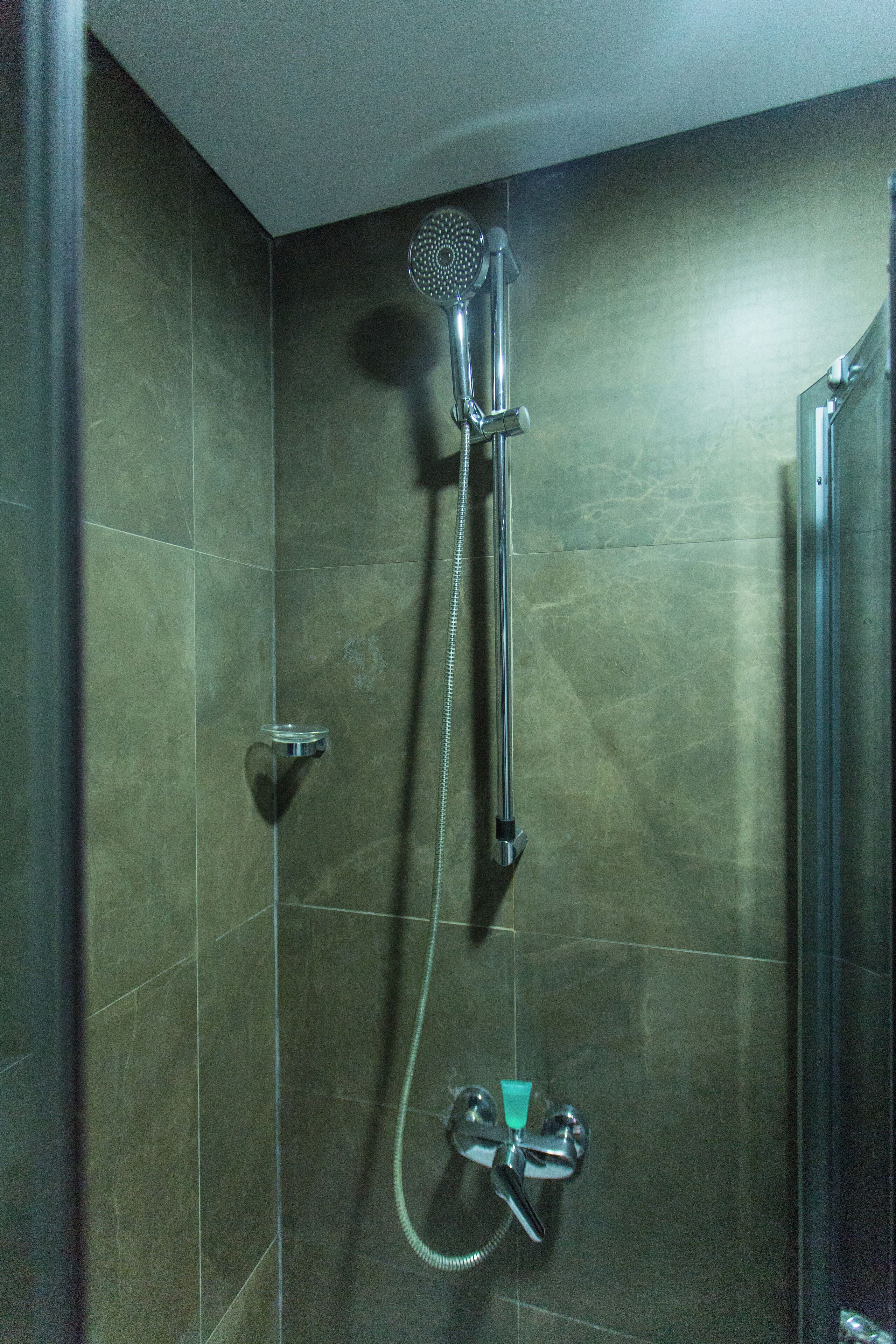 Shower, eco-friendly toiletries, towels, soap