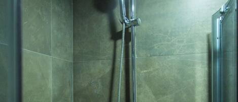 Shower, eco-friendly toiletries, towels, soap