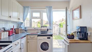 Fridge, coffee/tea maker, toaster, cookware/dishes/utensils