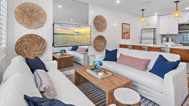 A modern living room with white sofas, a coffee table, and decorative woven baskets. - New to 30A! Freshly Renovated, Walk to Seaside, Pool, Easy Beach Access (Santa Rosa Beach)