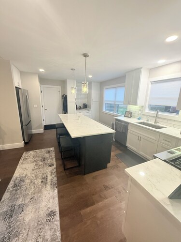 Cozy 2-bedroom condo in charming Northville with AC and gym access