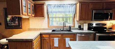 Refrigerador, microondas, horno y parrilla de estufa