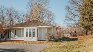 A single-story house with a gabled roof, a front porch, and a small attached garage. - The Guest Wing at Kateri: Luxury Stay Waynesboro (Waynesboro)