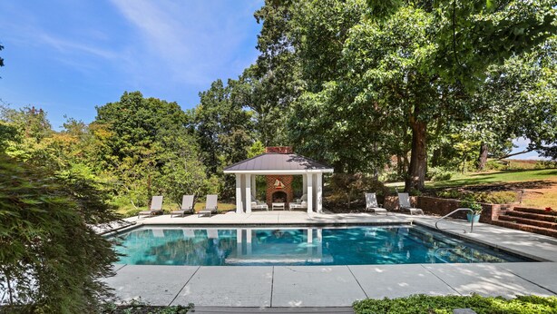 A swimming pool with a gazebo, surrounded by trees and a wooden deck. - The Guest Wing at Kateri: Luxury Stay Waynesboro (Waynesboro)
