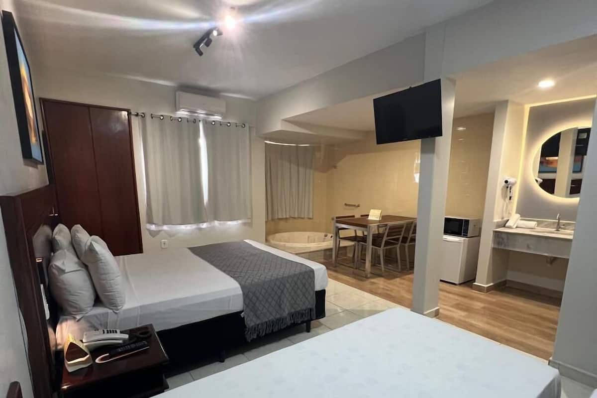 Luxury Studio, Multiple Beds, Private Bathroom, Pool View | Desk, laptop workspace, free WiFi