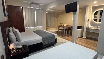 Luxury Studio, Multiple Beds, Private Bathroom, Pool View | Desk, laptop workspace, free WiFi