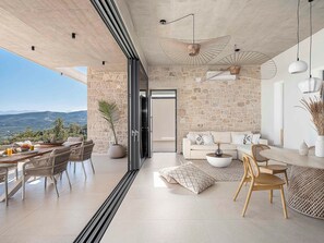 Luxury Villa, 2 Bedrooms, Private Pool, Sea View | Living area | 50-inch Smart TV with satellite channels, foosball - Himmel Villas (Kissamos)