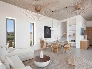 Deluxe Villa, 2 Bedrooms, Private Pool, Sea View | Living area | 50-inch Smart TV with satellite channels, foosball - Himmel Villas (Kissamos)