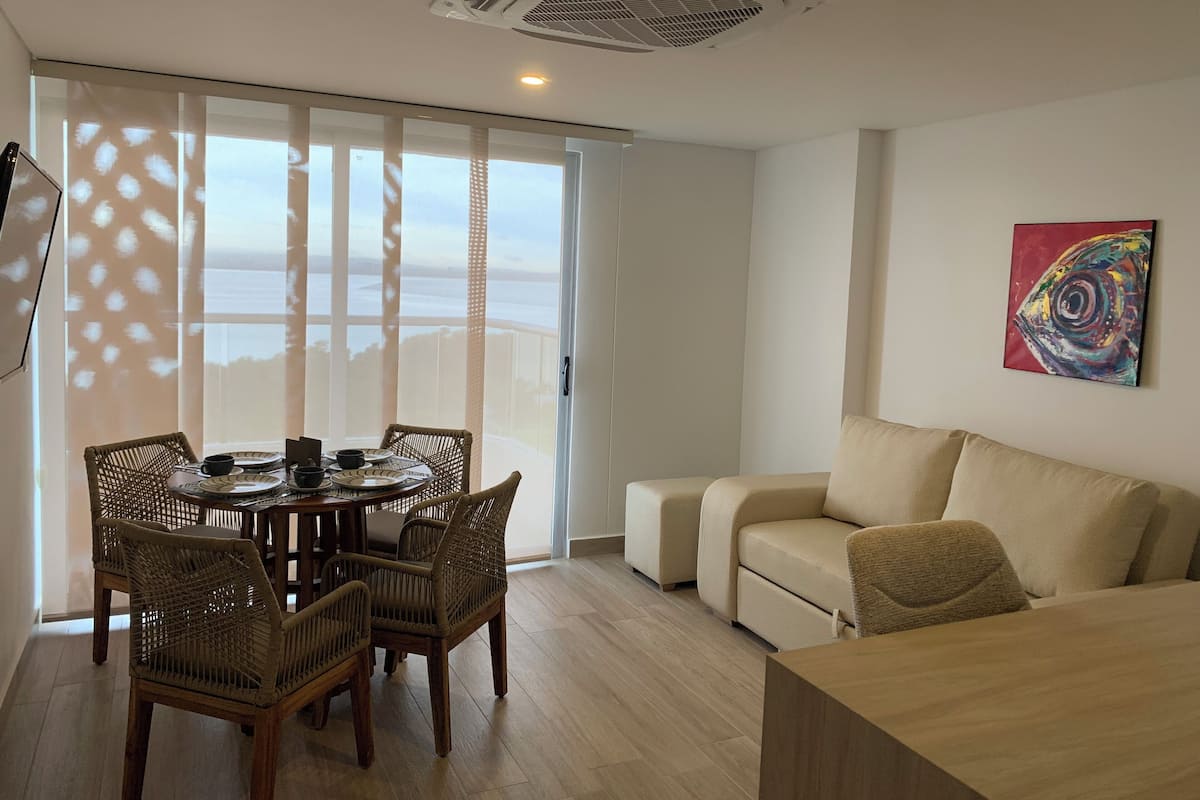 Superior Apartment, Balcony, Bay View | Living area | Flat-screen TV