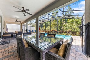 Outdoor dining - New!! Storybook Estate | 9BR Luxury Retreat with Theater, Arcade & Pool (Kissimmee)