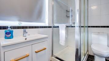 Shower, hair dryer, towels, soap