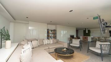 55-inch Smart TV with cable channels, fireplace, offices