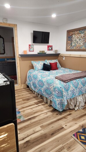 Tabla de planchar con plancha, wifi gratis y ropa de cama 