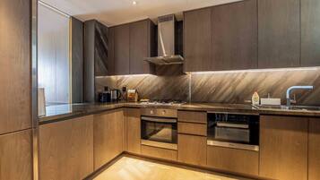 Signature Apartment, 1 Bedroom, Balcony, Partial Ocean View | Private kitchen | Fridge, microwave