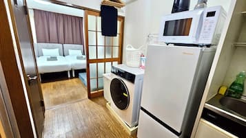 3 bedrooms, 1 sofa bed, Corner Ground Floor (101) | Private kitchen | Full-size fridge, microwave, oven, stovetop