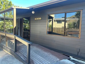 Exterior detail - A real kiwi bach in the heart of South Bay! Close to boat ramps and pet friendly (Kaikōura)