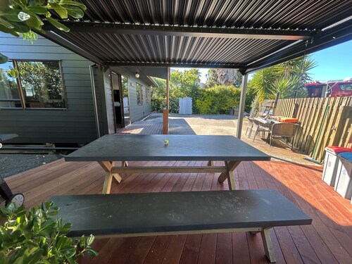 A real kiwi bach in the heart of South Bay! Close to boat ramps and pet friendly