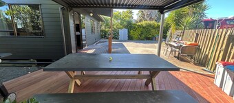 A real kiwi bach in the heart of South Bay! Close to boat ramps and pet friendly