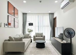 Family Suite, 3 Bedrooms, Club Lounge Access, City View | Living area | 65-inch Smart TV with cable channels, Netflix, pay movies