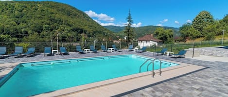 Seasonal outdoor pool, open 10:00 AM to 9:30 PM, sun loungers
