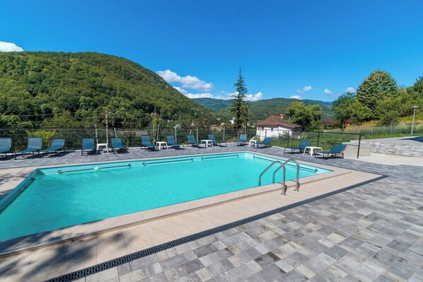 Seasonal outdoor pool, open 10:00 AM to 9:30 PM, sun loungers