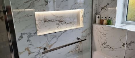 Shower, hair dryer, towels