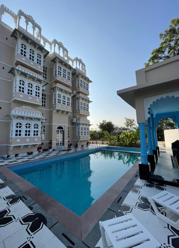 Outdoor pool, open 8:00 AM to 8:30 PM, free cabanas, pool umbrellas